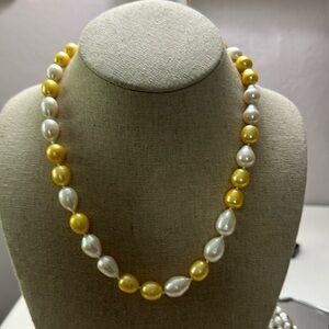 Cultured white and canary yellow pearls neckless 18”  14k gold clasp.